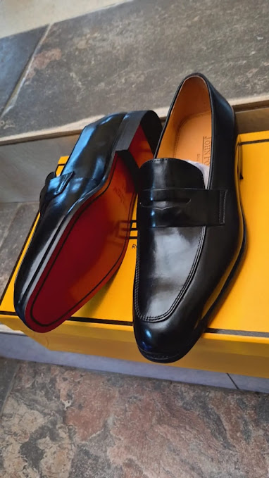 John Foster Men's Black Premium Leather Penny Loafers with Signature Red Sole